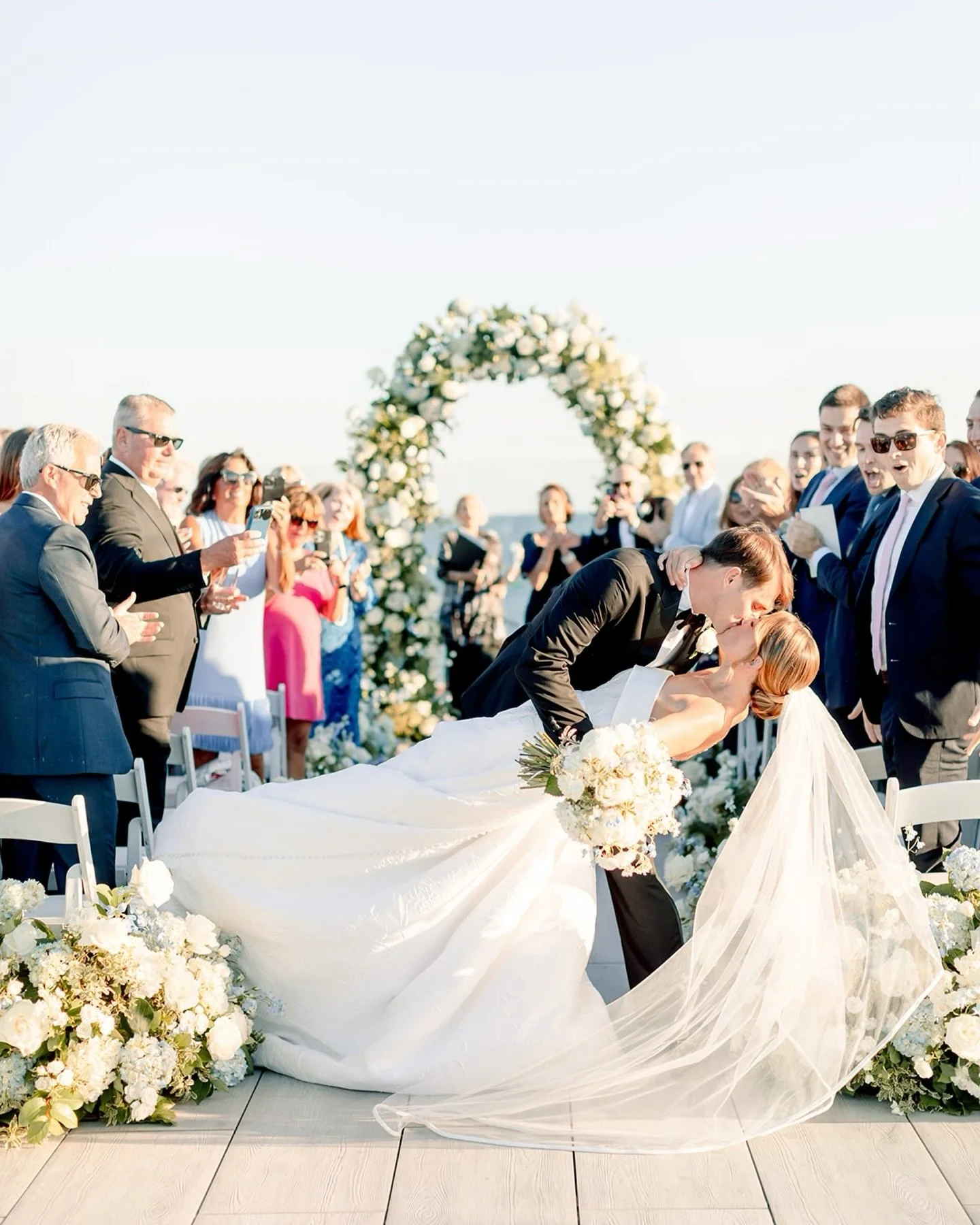 You know those wedding days where the energy is just good from the start? That was Jennifer + Brendan’s. From a champagne pop that (literally) hit me in the face 😂 to a rooftop after-party under the stars, their Wychmere celebration couldn&rsq