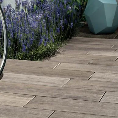 NAU CONTEMPORARY Nau interprets the character of reclaimed wood on a durable porcelain paver. Available in either squares or planks, Nau creates outdoor living spaces with distinctive urban flair.
