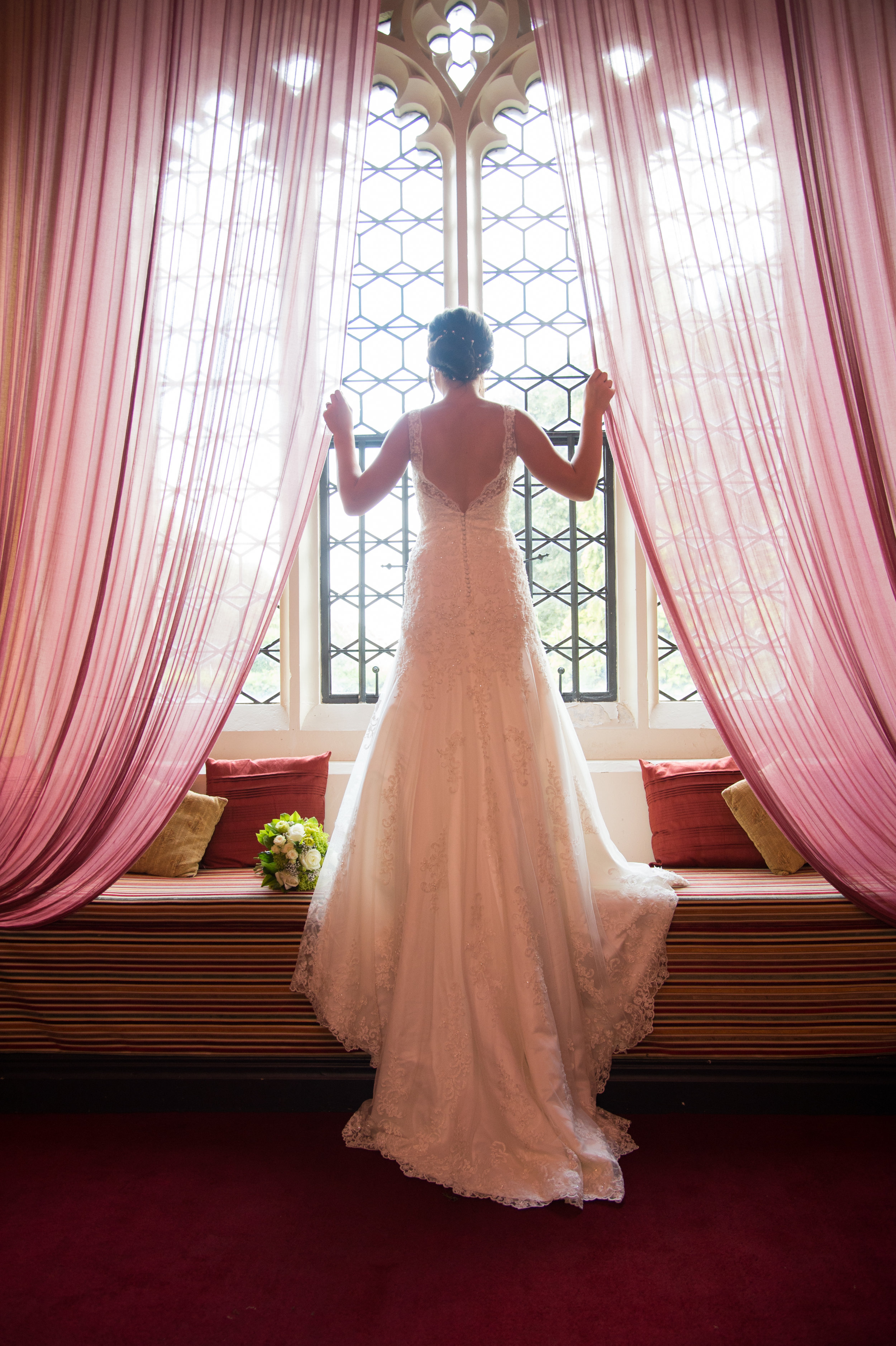 Bride in the window Coombe Abbey Hotel Warwickshire