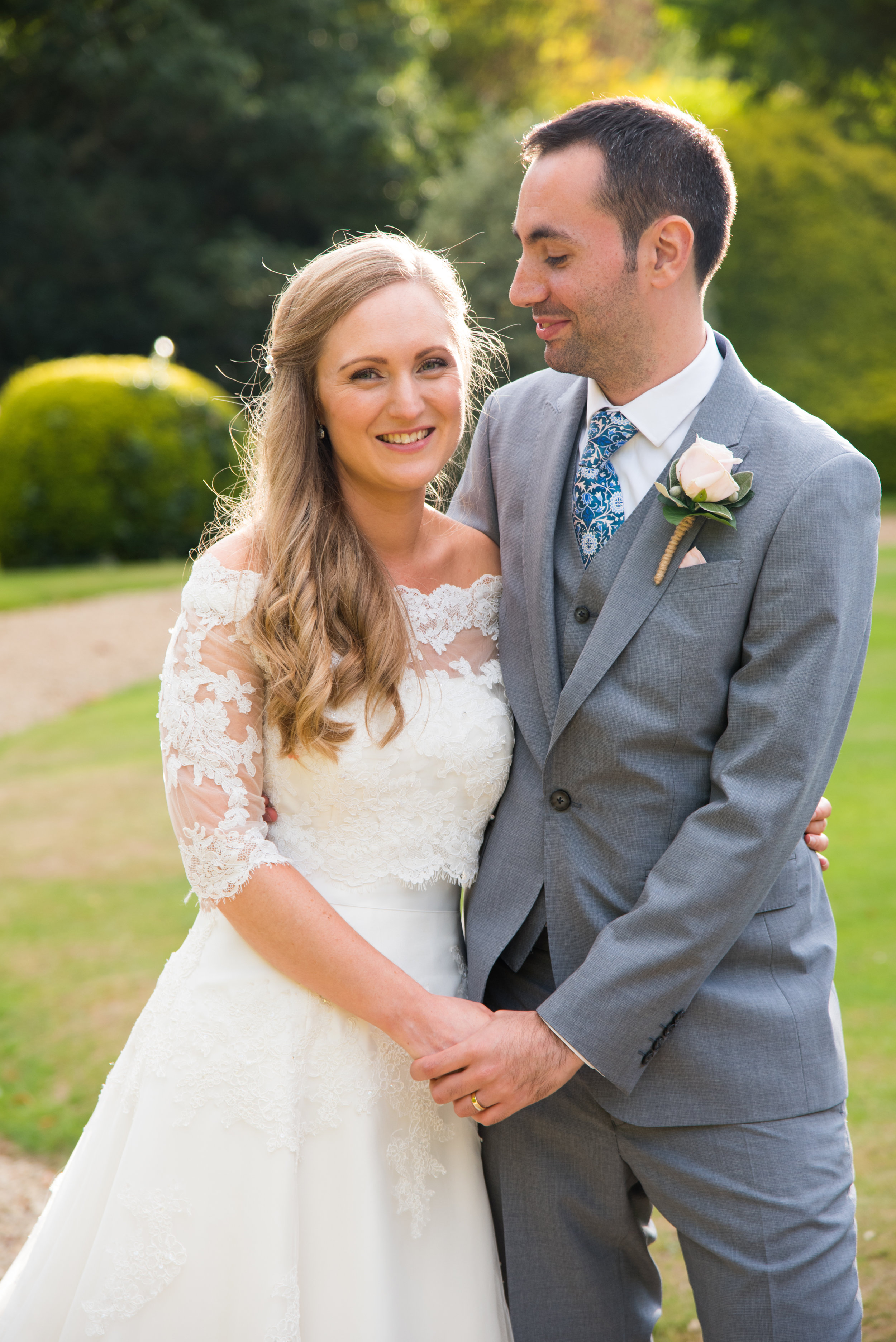 Bride and Groom hold hands Highbury Hall Birmingham