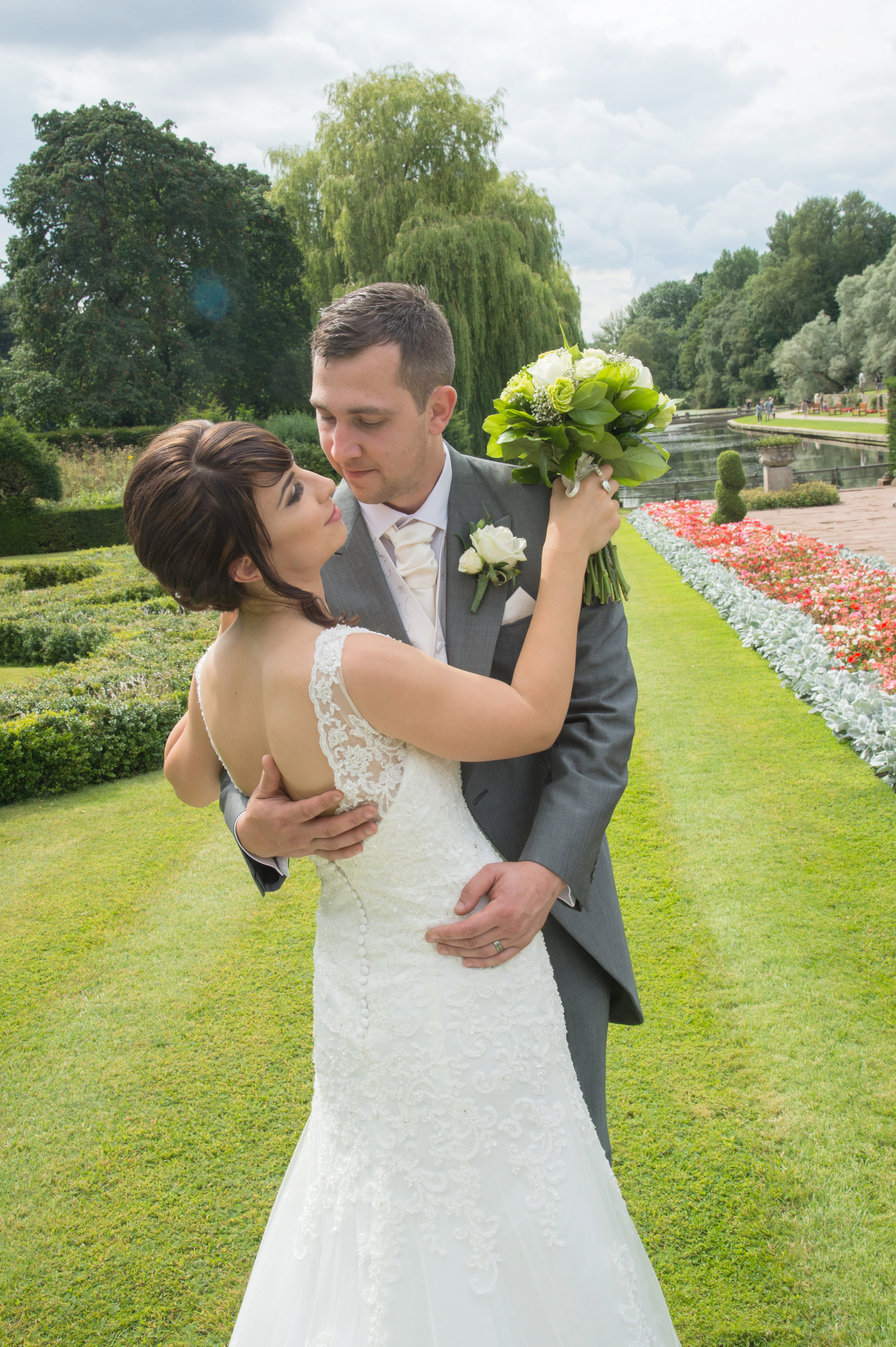 Bride and Groom kiss on the Lawn at Coombe Abbey Warwickshire