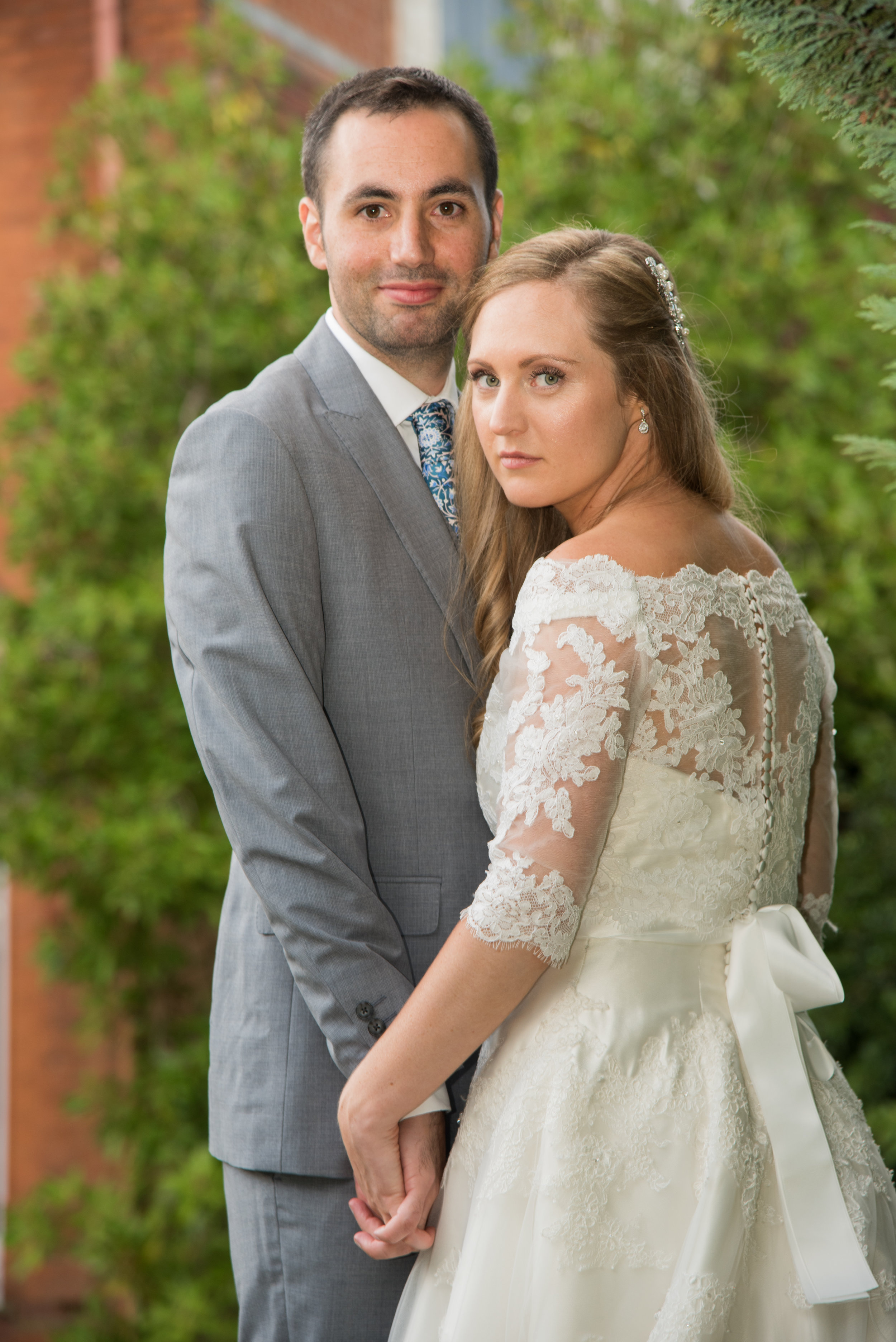 Bride and Groom hold hands Highbury Hall Birmingham