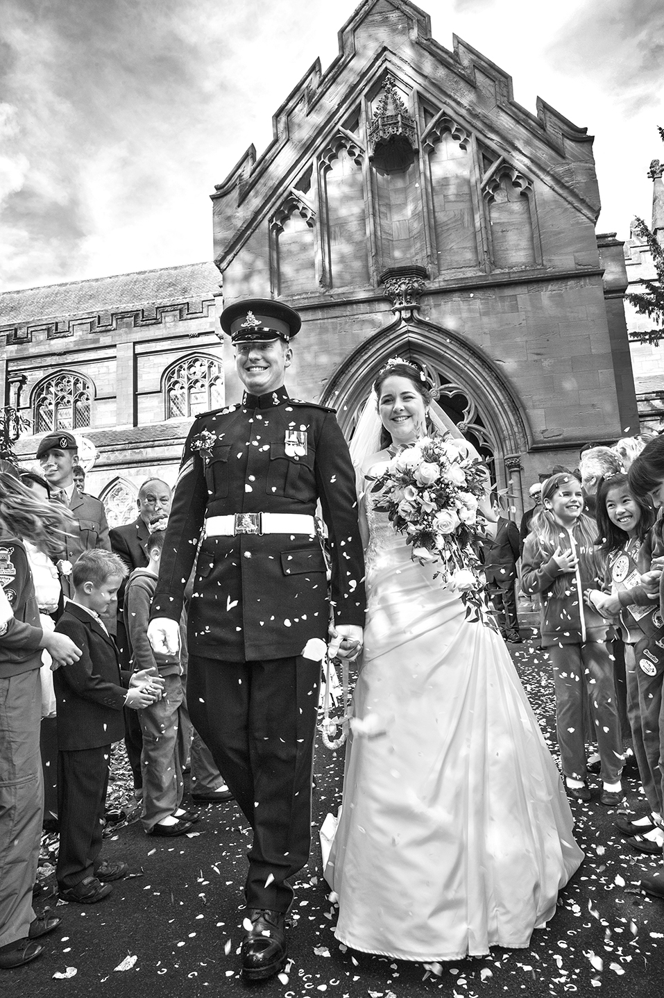 Bride and Groom confetti photo by Clickspeed Wedding Photography St John the Baptist Church Kidderminster Worcestershire