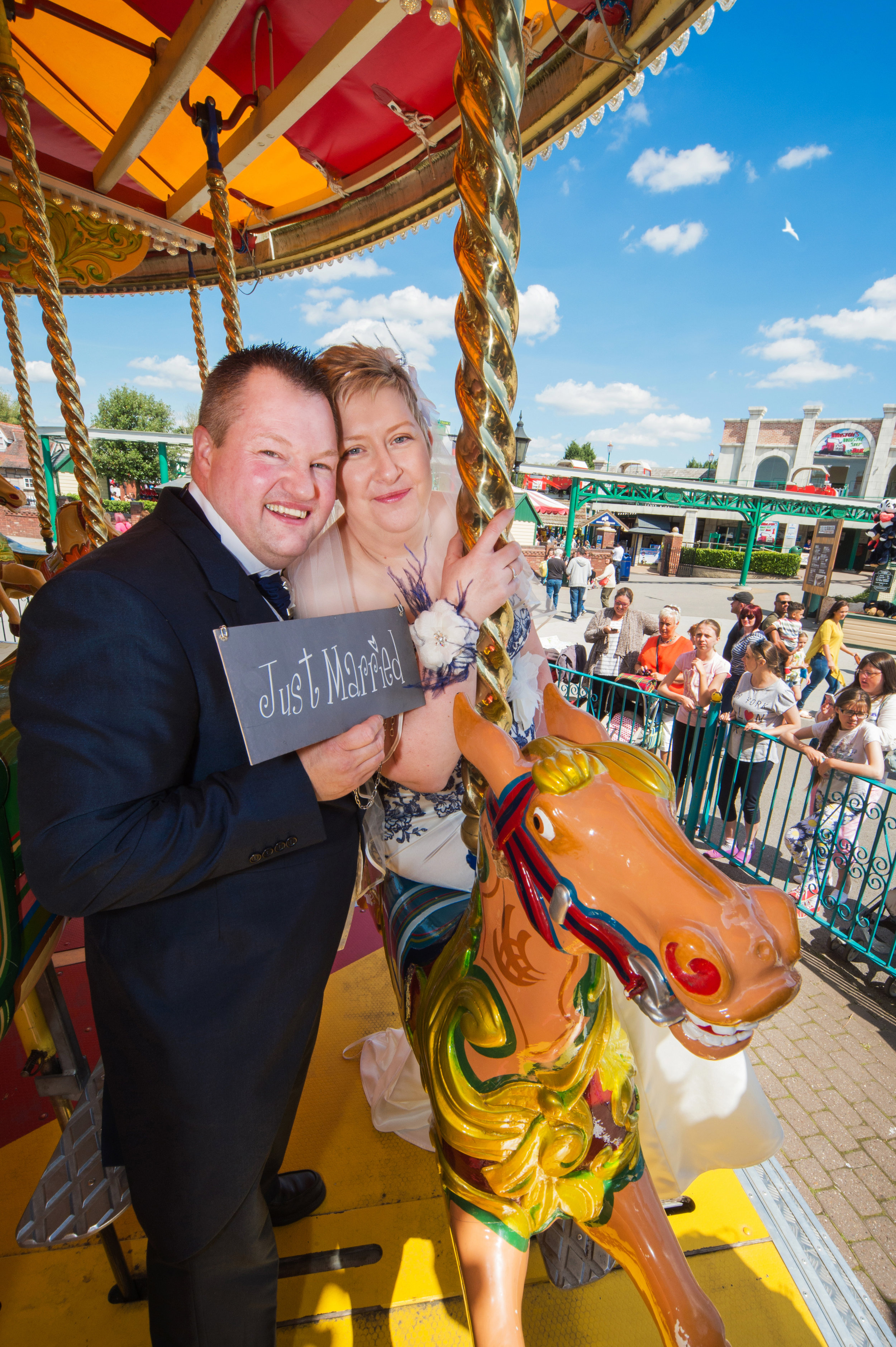 Bride and Groom on Carousel Drayton Manor Hotel Tamworth Staffordshire