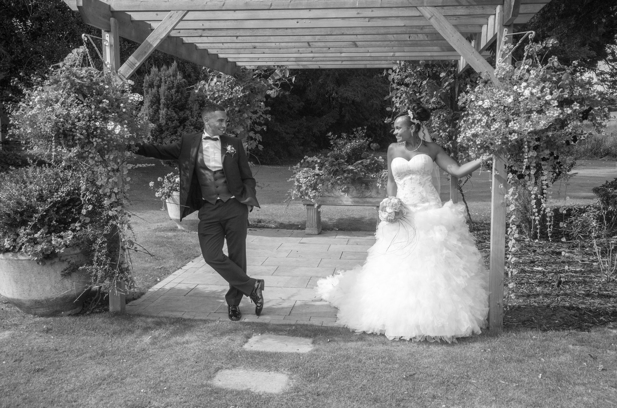 Bride and Groom under pergola Brandon Hall Hotel Coventry Warwickshire
