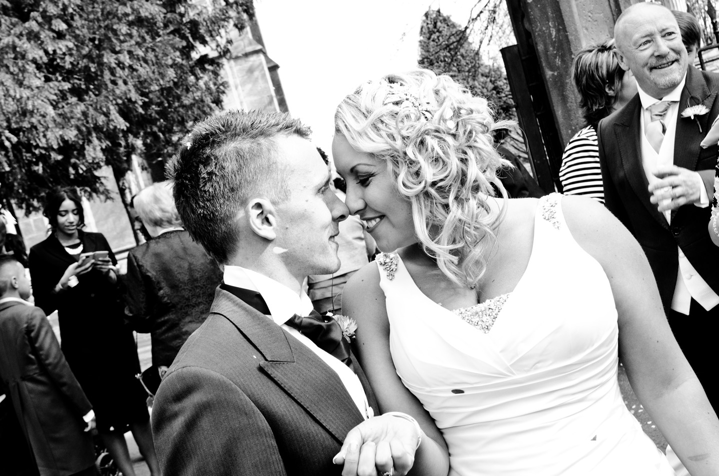 Bride and Groom kiss Holy Trinity Church Wordsley Stourbridge