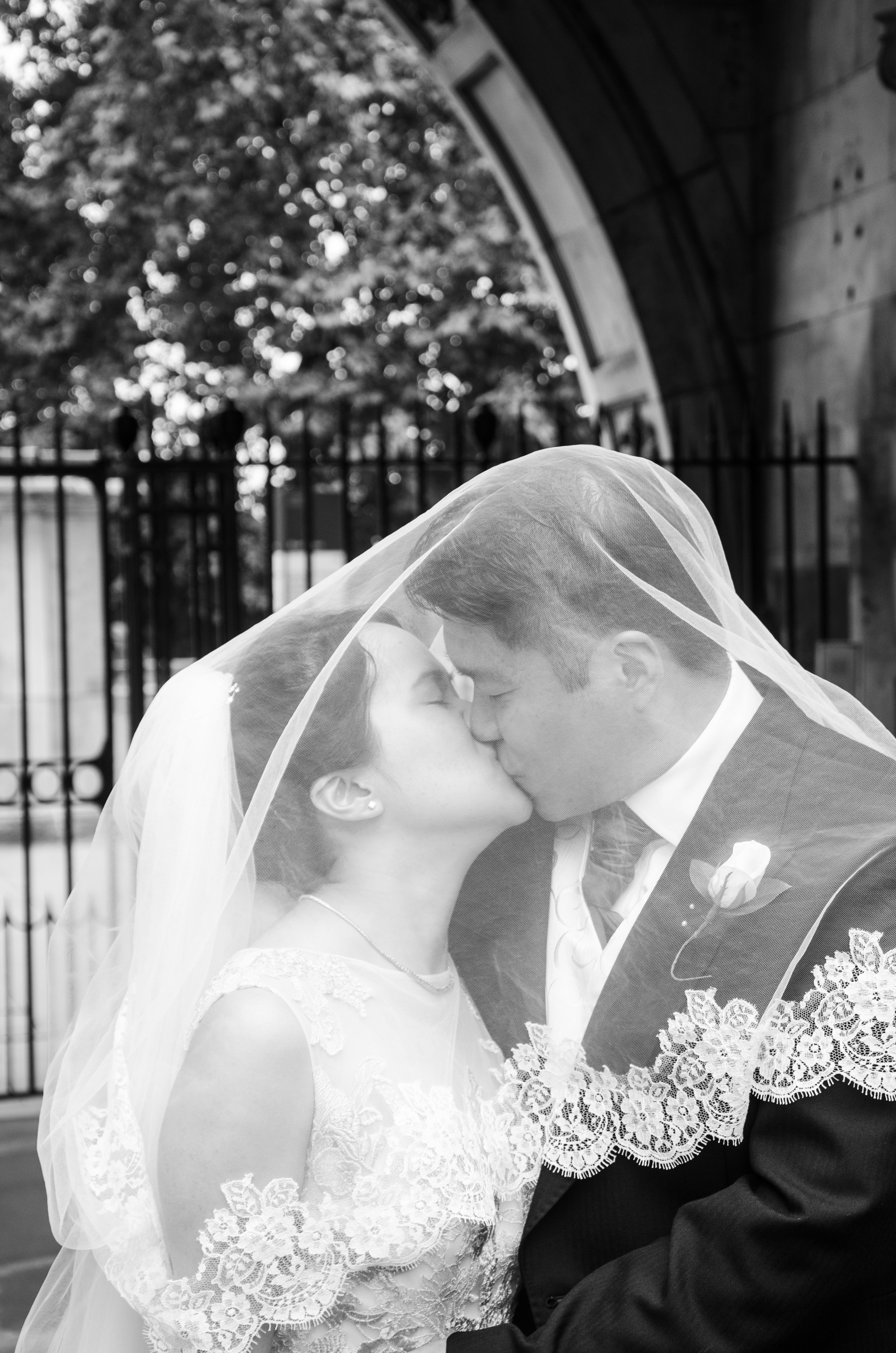Bride and Groom kiss Kings College London
