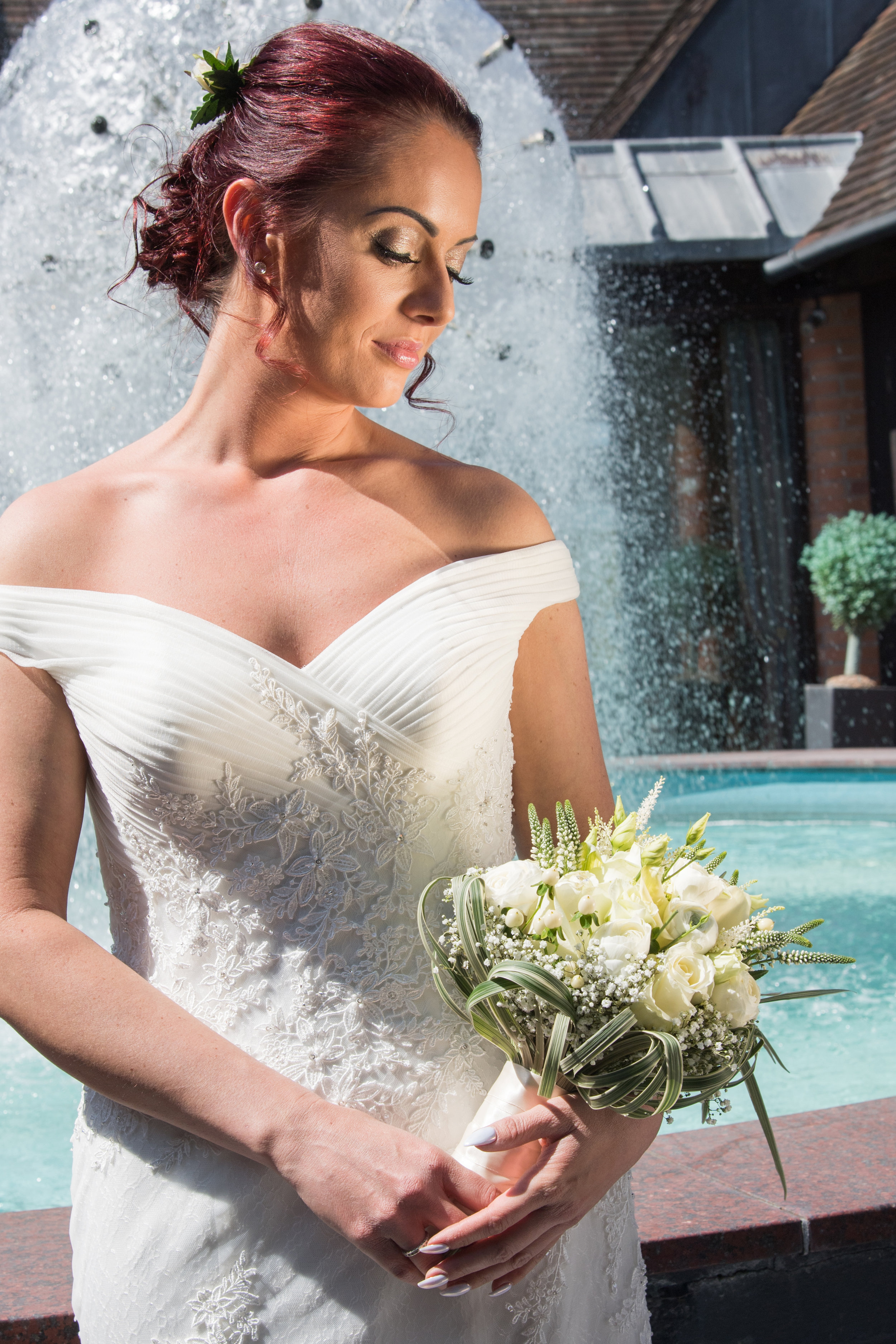 Bride in front of fountain Henley Golf Club Warwickshire
