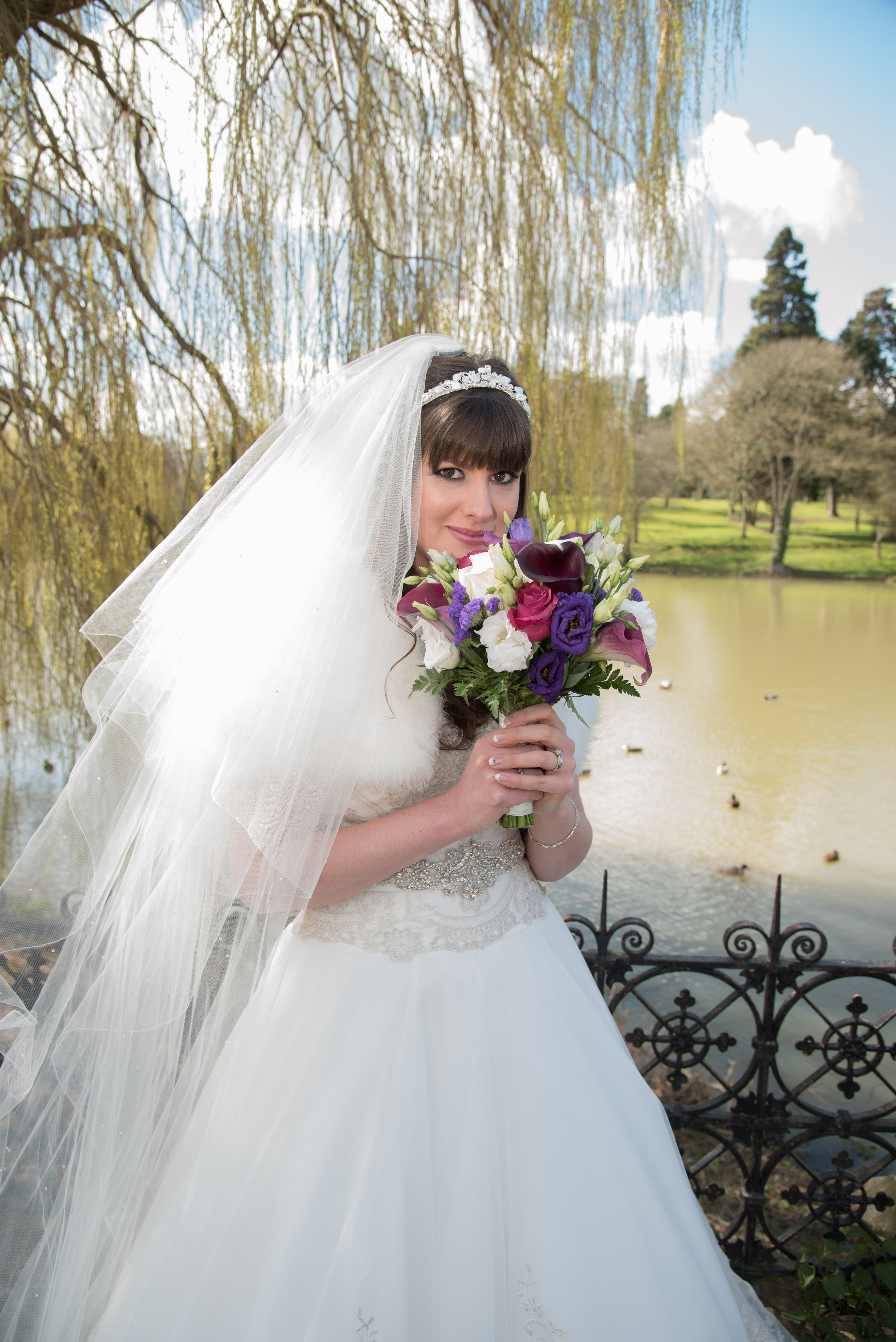 Bride on bridge Walton Hall Hotel Warwickshire