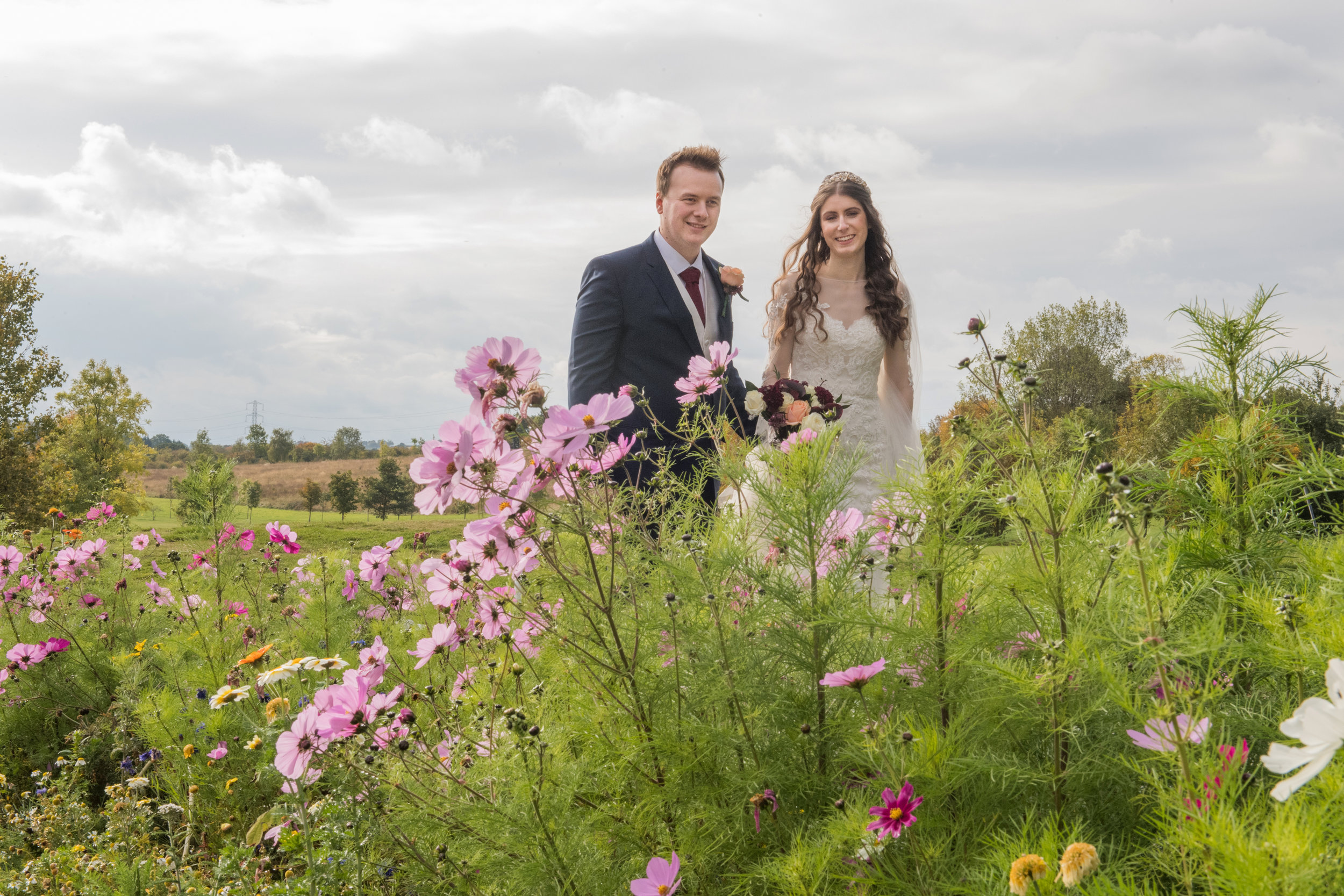 Bride and Groom strolling through the gardens of Henley Golf and Country Club