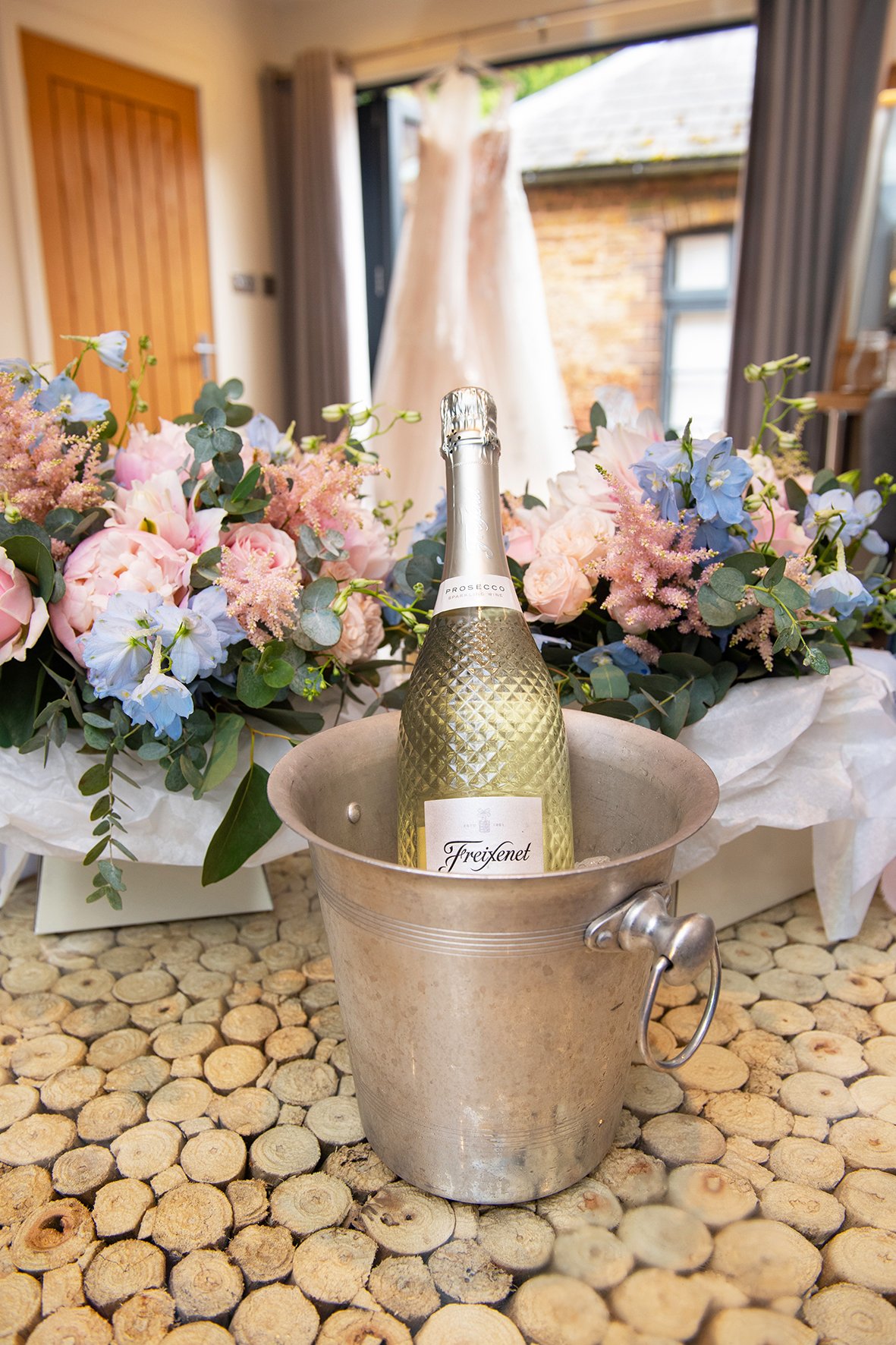 Wedding dress and bubbly Bredenbury Court Barns Herefordshire