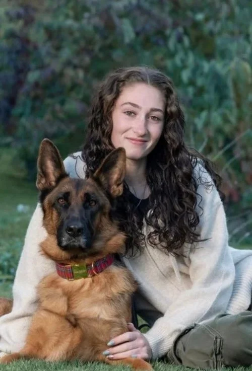 Apprentice Dog trainer on Cape Cod with a German Shepherd.