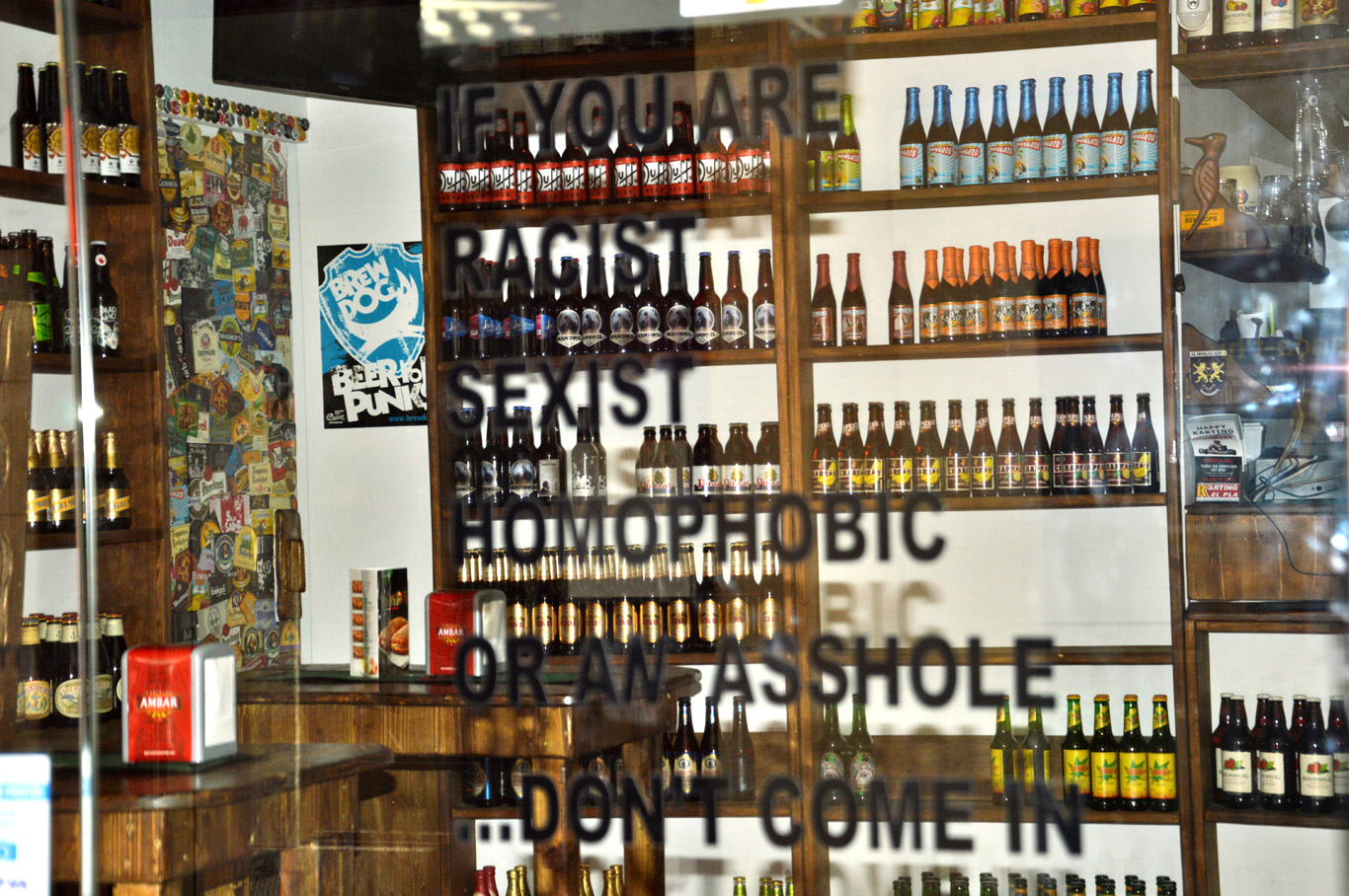 Read the sign on the window of this liquor store
