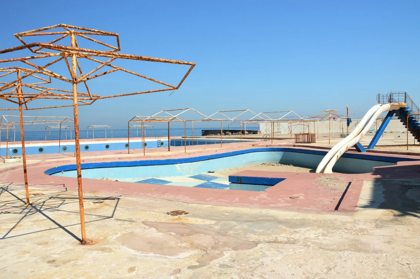 Abandoned swimming pool area near the coast