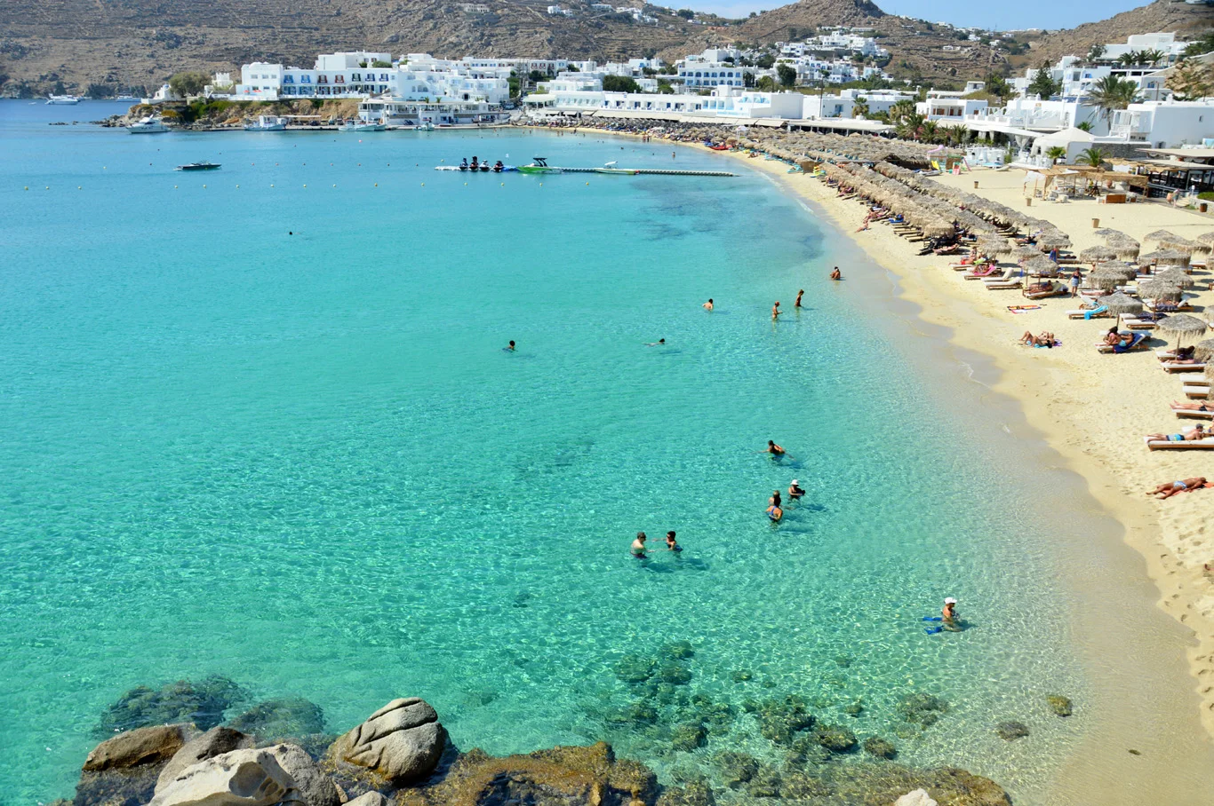 Greek Mykonos Beaches Soak Up The Sun On Psarou Beach In Mykonos