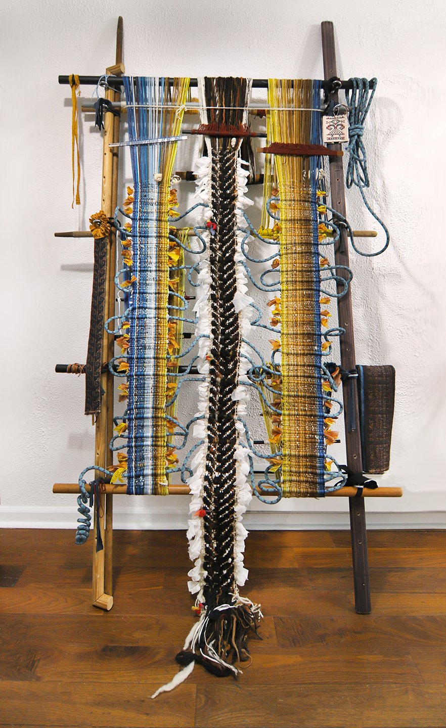  Kira Dominguez Hultgren,  In the Silence between Mother Tongues , 2022, silk from a salwar and chunni that artist’s grandmother wore, two nalas, rope from artist’s favorite Utah climbing gym, paracord, found wood, plastic and metal loom bars, heddle
