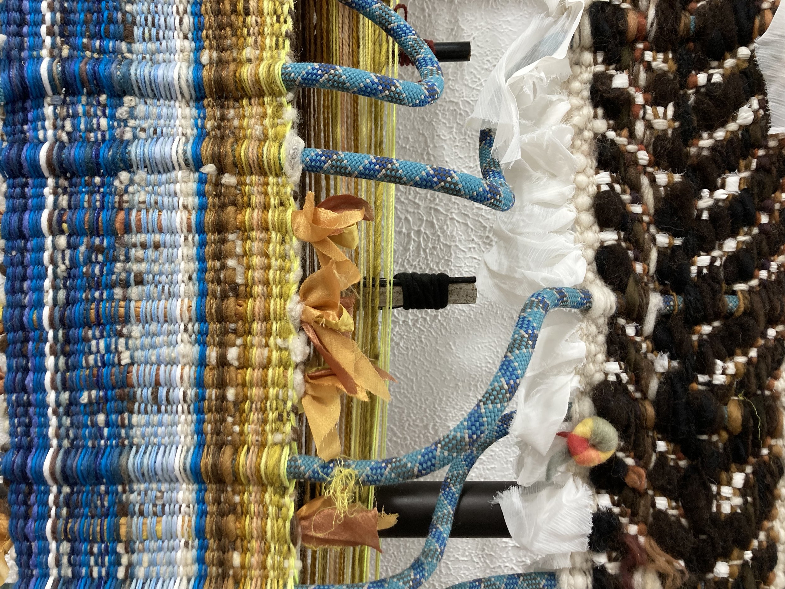  Kira Dominguez Hultgren,  In the Silence between Mother Tongues  (detail), 2022, silk from a salwar and chunni that artist’s grandmother wore, two nalas, rope from artist’s favorite Utah climbing gym, paracord, found wood, plastic and metal loom bar