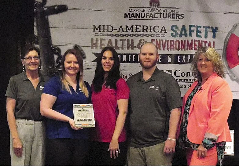 CNH Industrial Reman receiving their Safety Manufacturing Company of the Year Award from MAM's CEO, KIM Inman