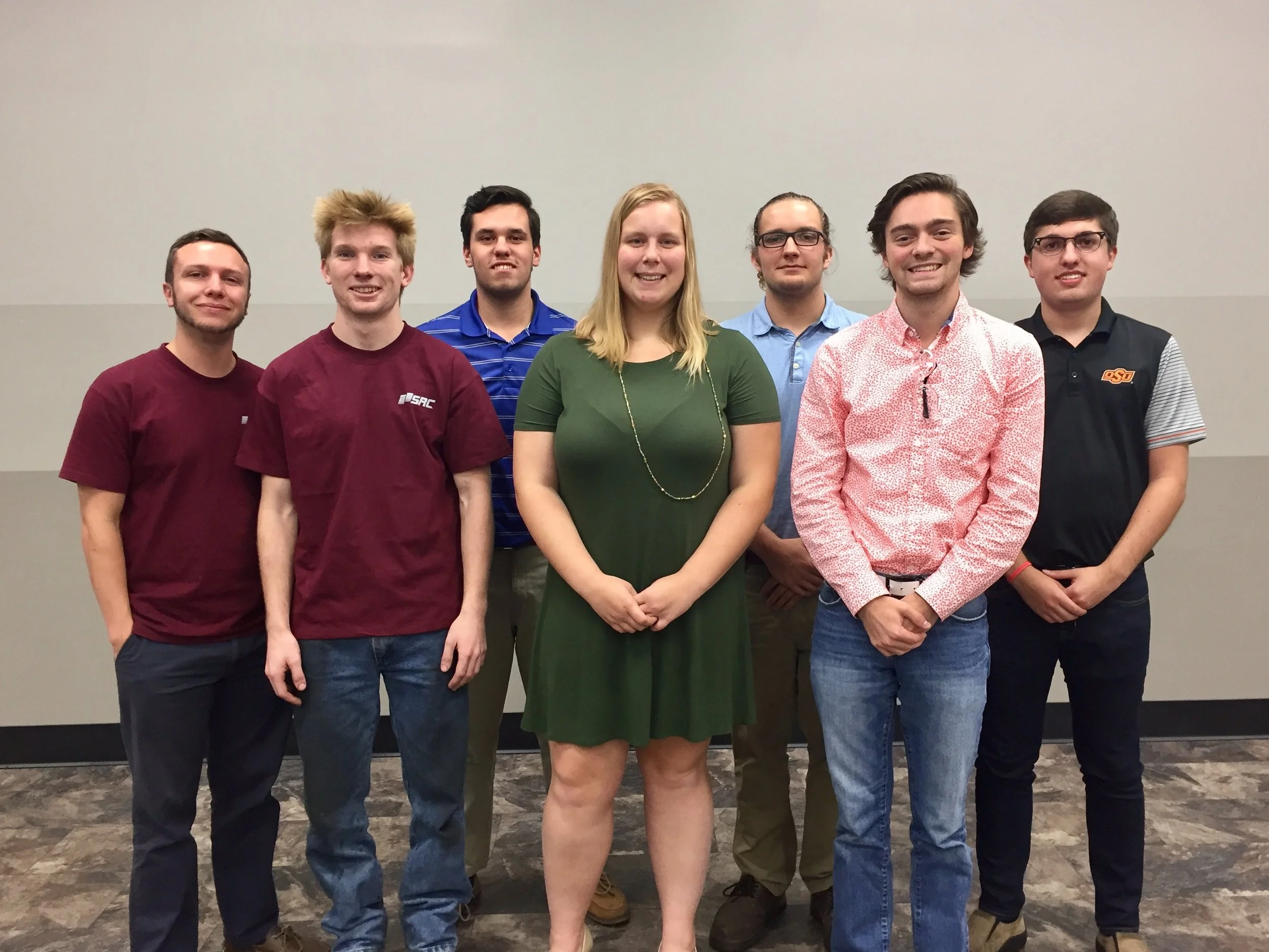 Logan Kunkel (back row; left) and Westin Easley (back row; middle), along with the fellow interns at Springfield Remanufacturing Corporation's Heavy Duty location, gave presentations about their summer projects to their superiors.