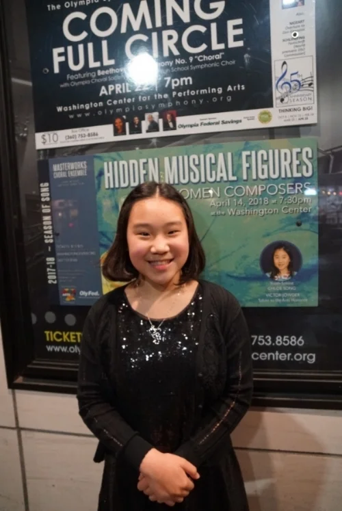 Chloe smiling in front of her poster at the Washington Center. This must be after her performance, she looks so happy!