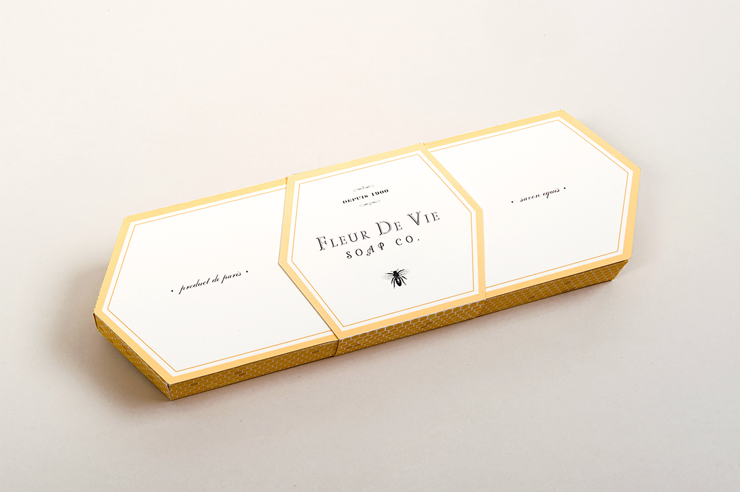 Fleur de Vie is a fictional soap company that produces flower-scented soaps infused with honey. The packaging includes three hand-carved soaps named after a specific flower. (Student work, Tyler School of Art)