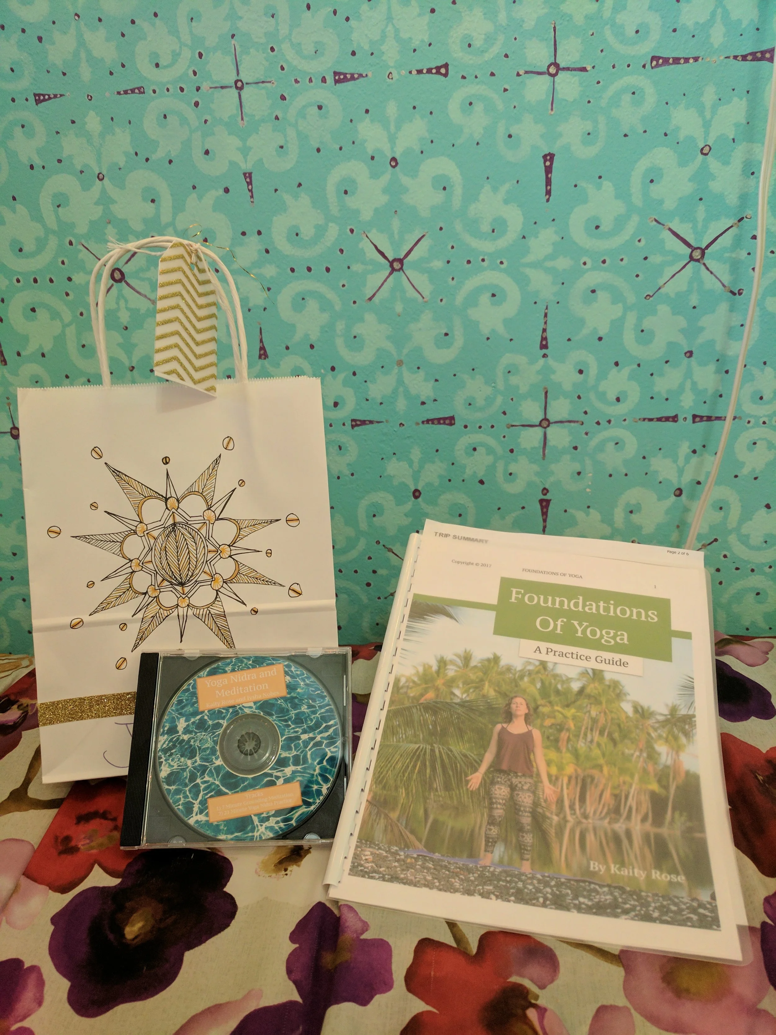 Final products! A Foundation's of Yoga Manual, hand-drawn goodie bag full of yogic surprises, and a Yoga Nidra/Meditation CD for each of our students.
