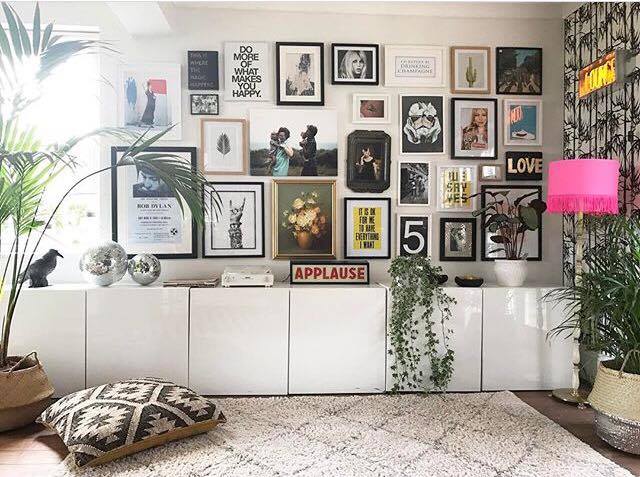 Gallery wall by Lisa Dawson Styling . I love the mismatched frames and prints above these Ikea storage units, they have been cleverly planned and laid out to create a full gallery wall, each print fits into its own planned space all accessorised with a hint of shocking pink and greenery.