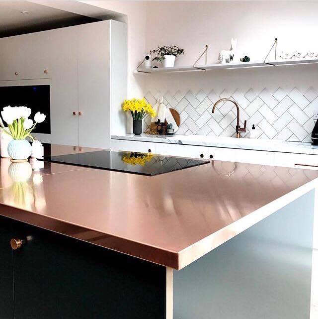 I love this use of copper in Jade's kitchen. Her work surface is paired beautifully with the green cabinets below to create the main feature in her kitchen. I love its shiny surface reflecting the rest of the kitchen yet it adds a lovely warmth against the white surroundings. 