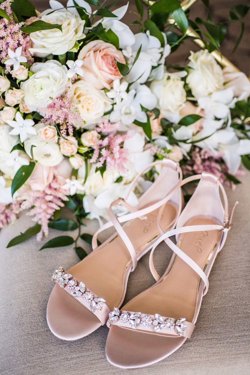 Rose gold bridal heels next to a bridal bouquet by  Arcadia Floral Co.