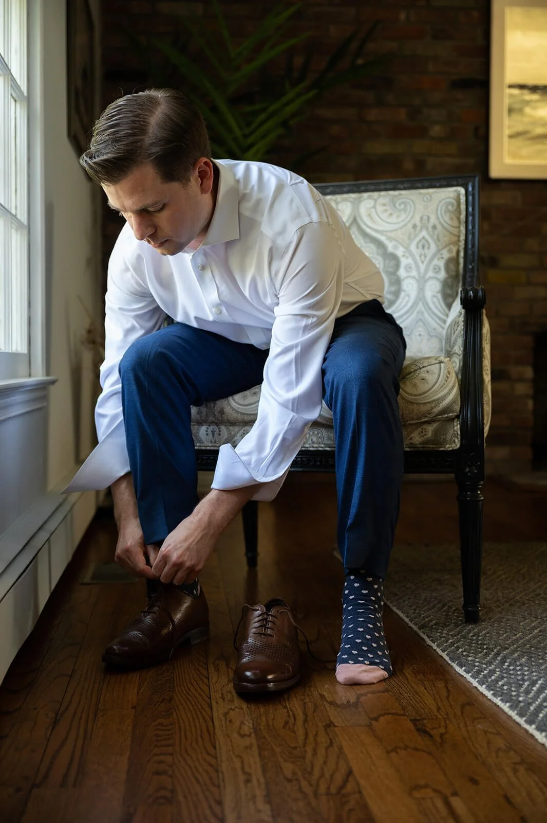 Groom getting ready for his backyard wedding in New York