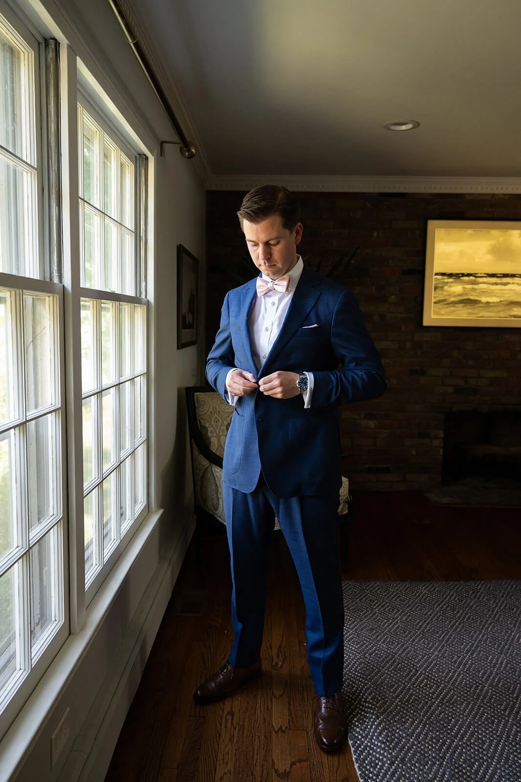 Groom getting ready for his backyard wedding in Long Island, New York