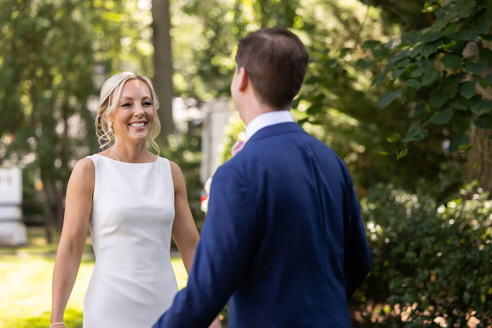 Bride and groom having a first look before their backyard wedding in Long Island, New York