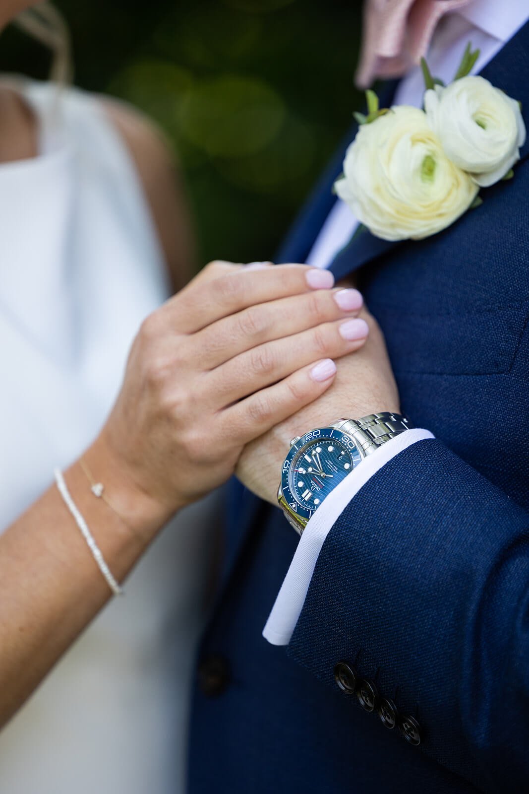 wedding day details, groom and bride holding hands