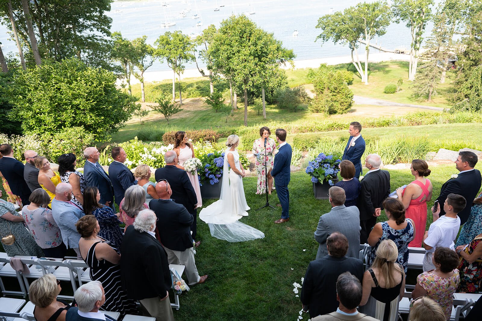 Backyard wedding ceremony in New York, overlooking Huntington Bay.