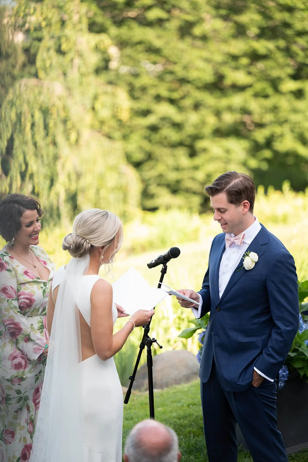 Couple reading their own vows for a wedding planned by Danielle Caldwell Events