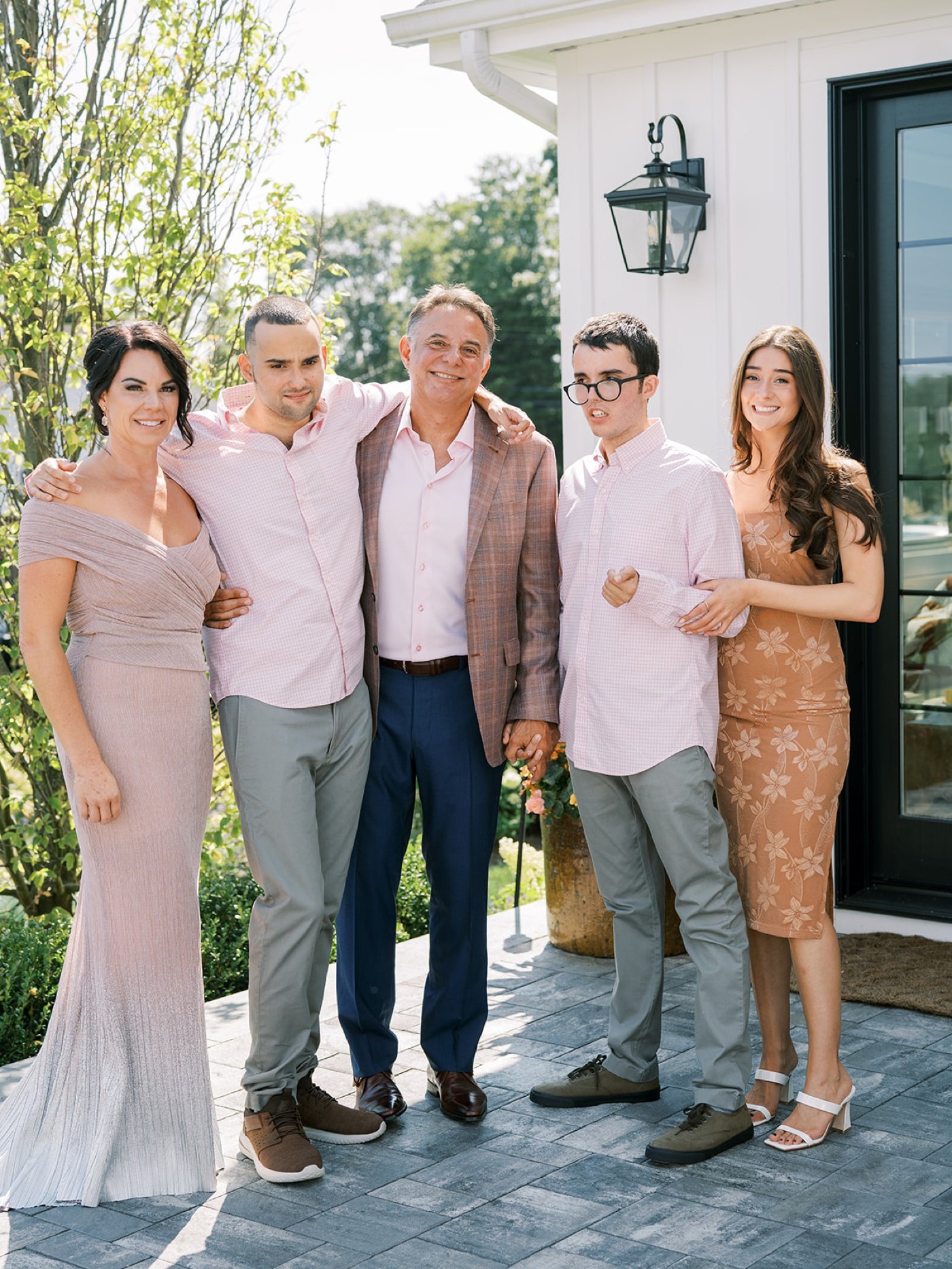 Family portraits at a summer wedding in Blue Point