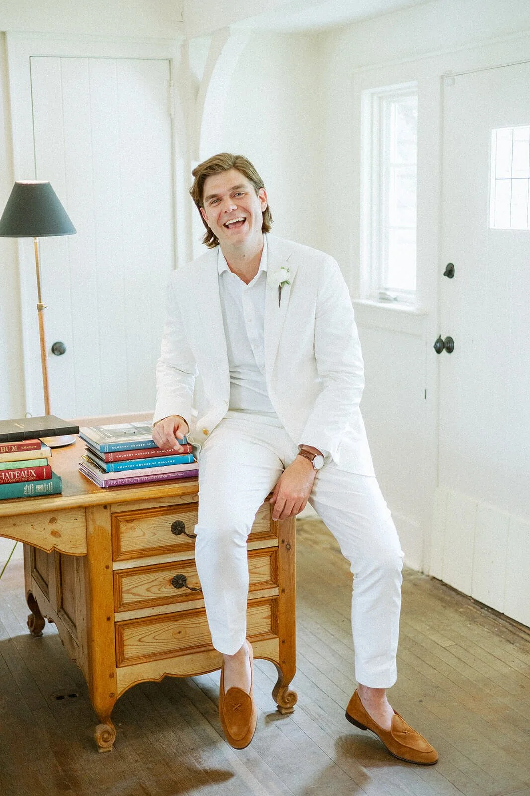 Groom getting ready for his backyard wedding in Montauk