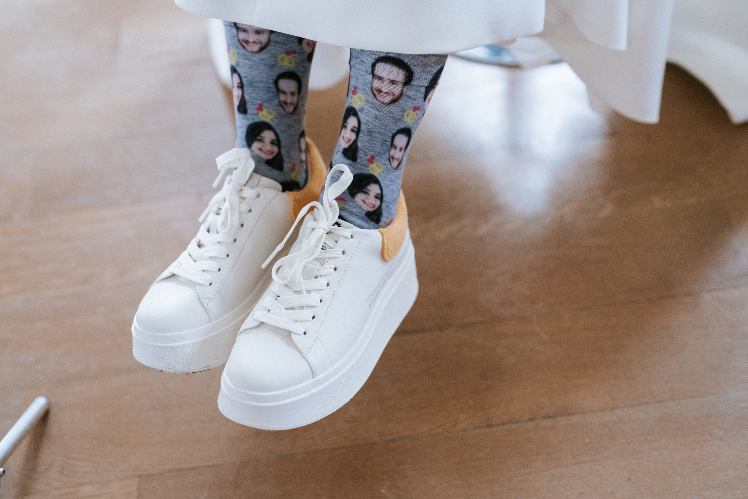 Bride wearing custom socks with faces on them