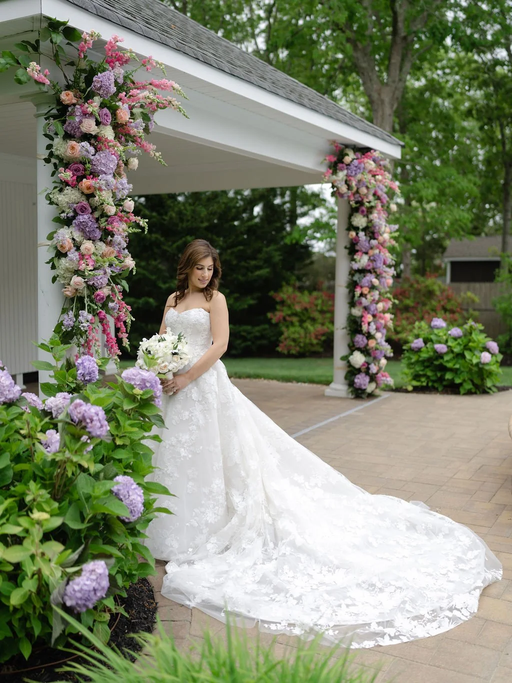 Bridal portrait at Canoe Place Inn &amp; Cottages, wearing a Monique Lhuillier gown