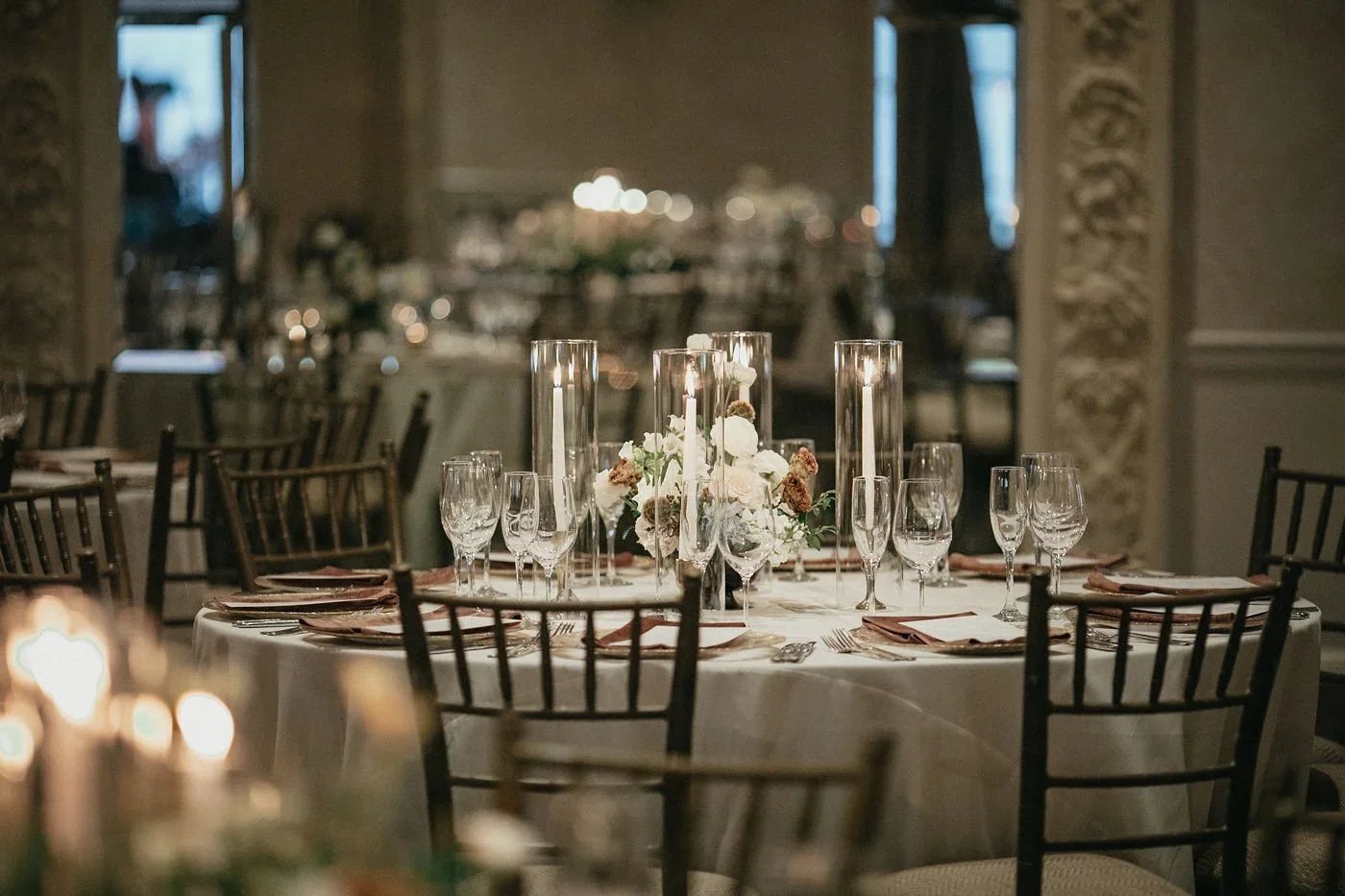 table with beautiful white candles showcasing winter weddings in New York