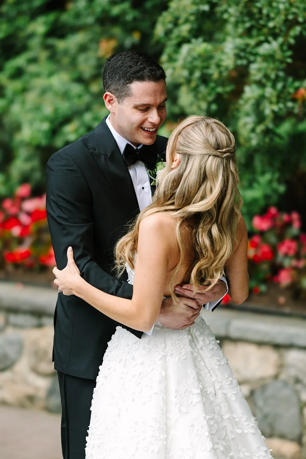 Groom turning around to see the bride for the first time, smiling during an intimate first look