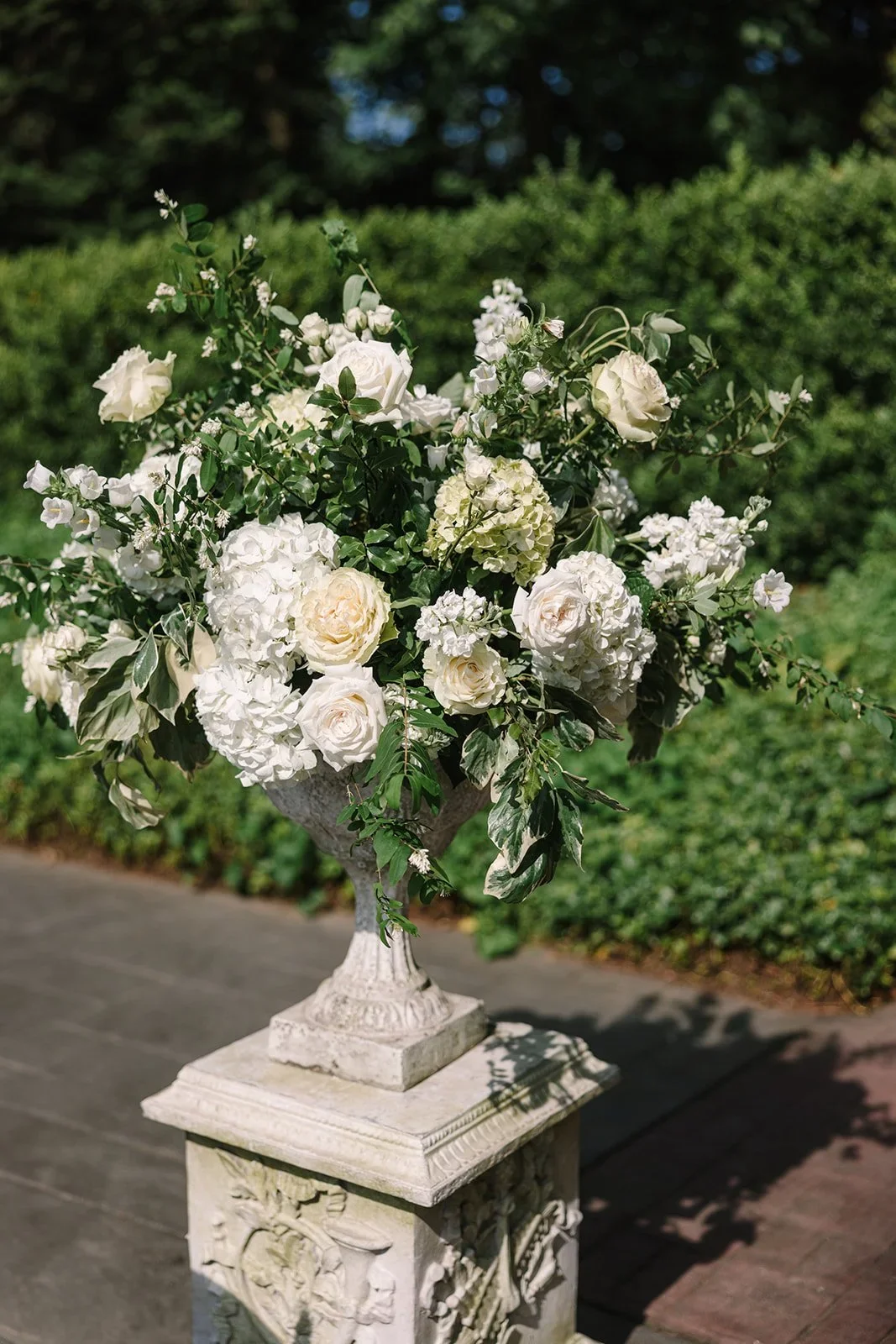 Close-up of lush floral details featuring soft whites and greenery