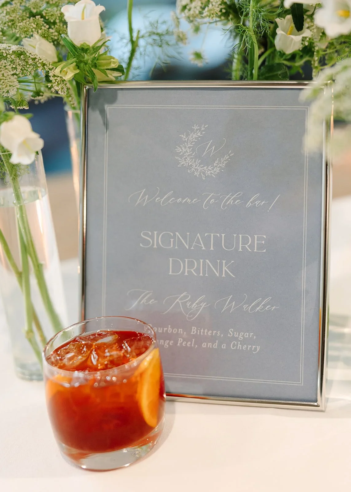 Signature drink menu displayed at the reception bar