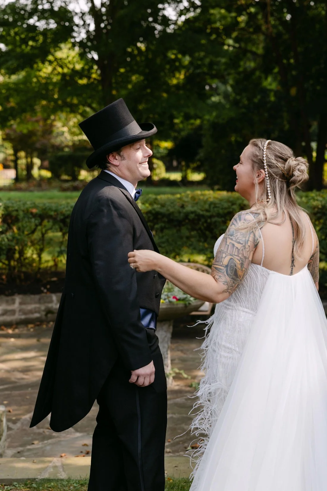 Joyful first look moment between bride and groom during their outdoor wedding in New York