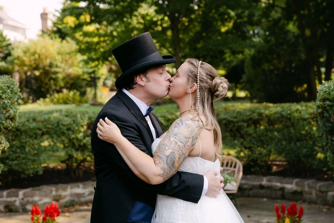 Bride and groom share a kiss during their outdoor wedding in New York first look