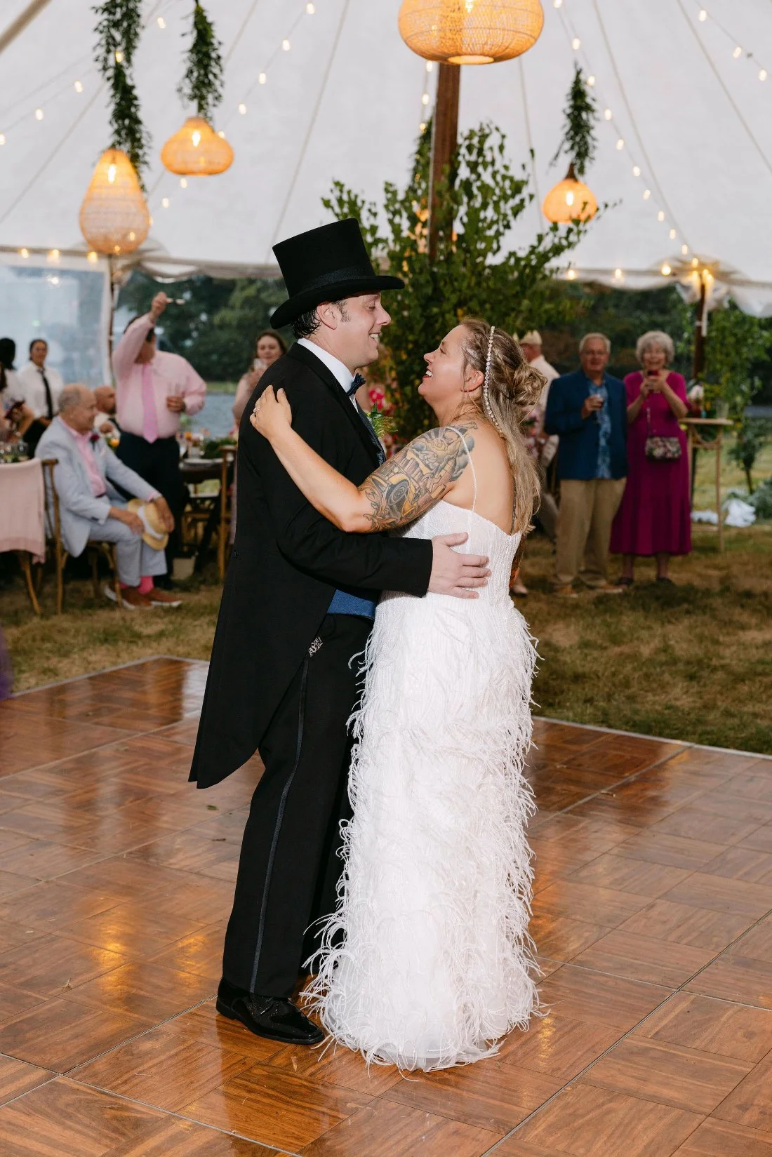 Bride and groom share their first dance under the tent at their outdoor wedding in New York