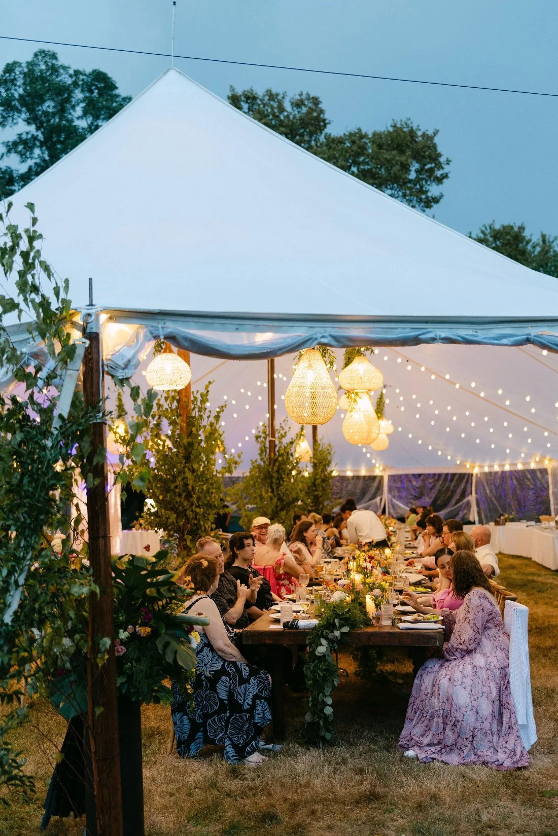 tent set up on a lush lawn for an outdoor wedding in New York