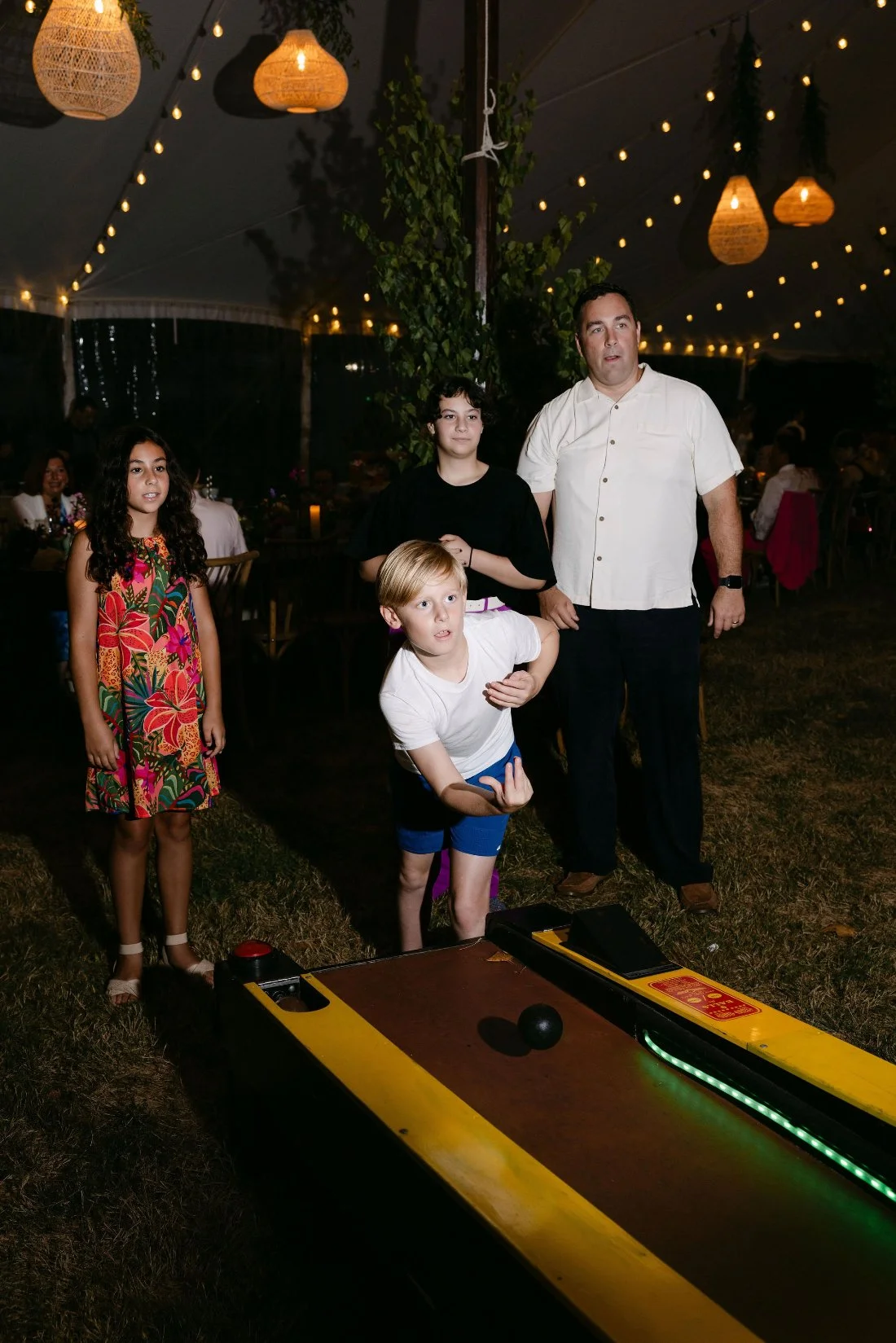 Guests enjoying games during the reception at an outdoor wedding in New York