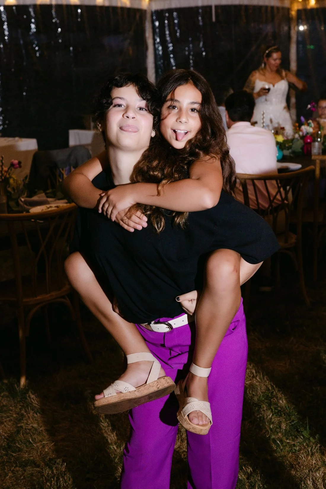 Kids dancing and playing on the dance floor under the wedding tent in New York