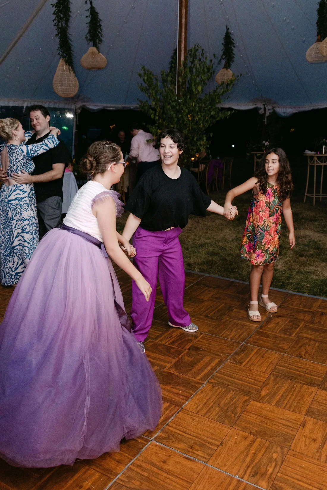 Lively dance floor filled with guests during an outdoor wedding in New York